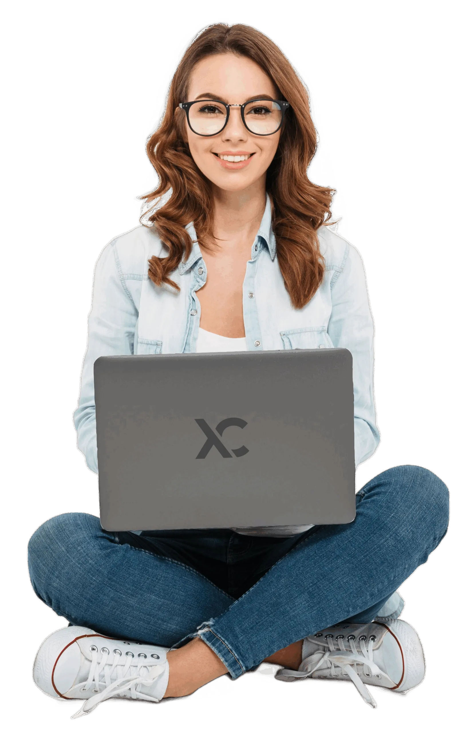 Smiling woman sitting cross-legged with laptop