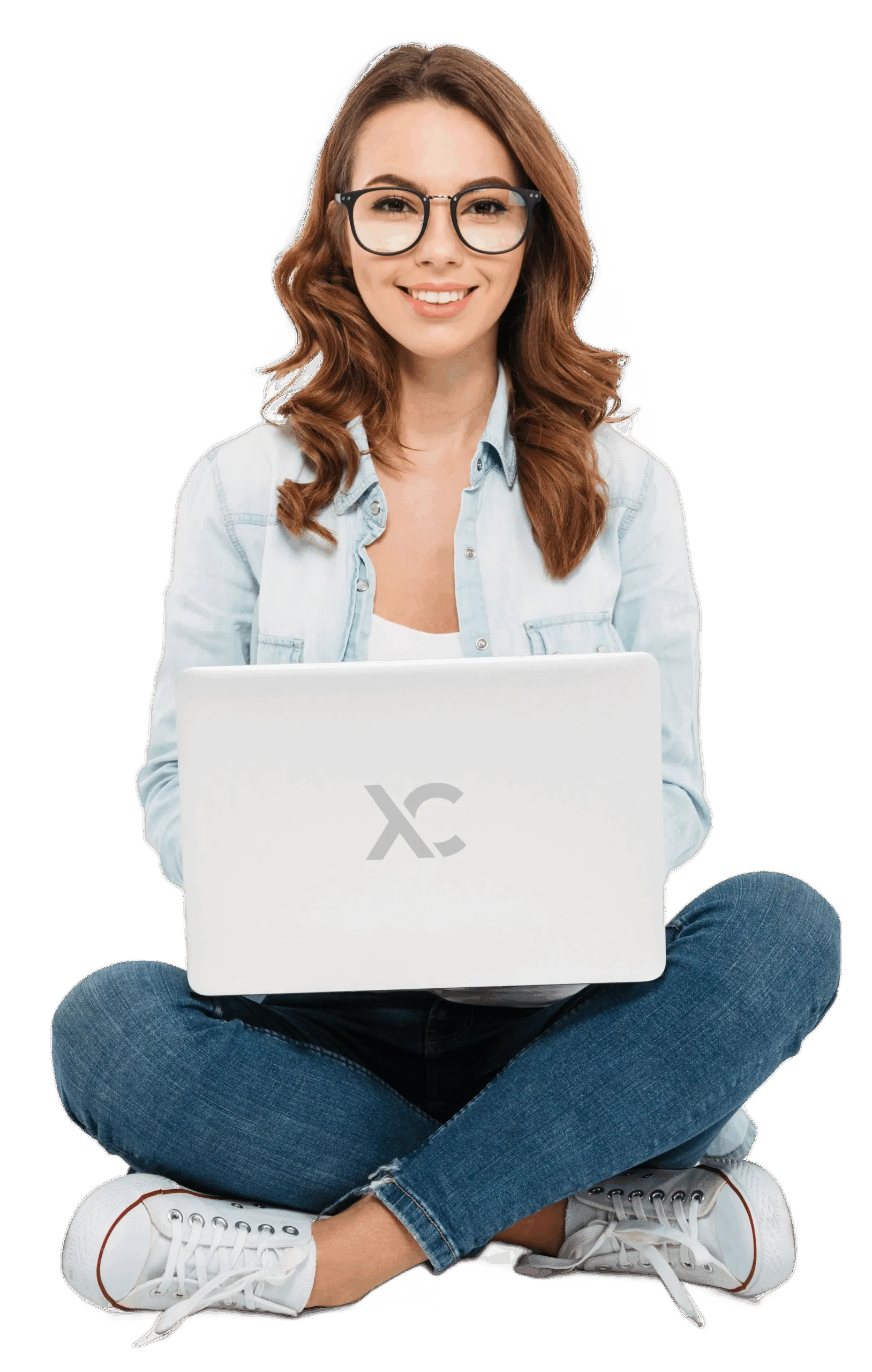 Smiling woman sitting cross-legged with laptop